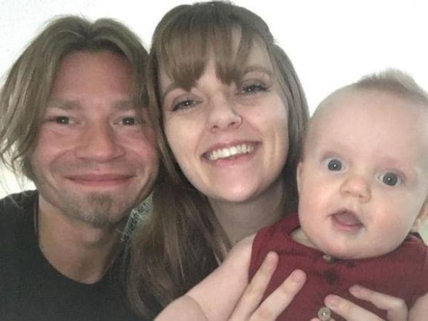 Bear Brown with his wife and newly born son.